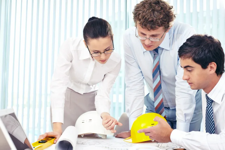 engineers discussing upstream petroleum economics