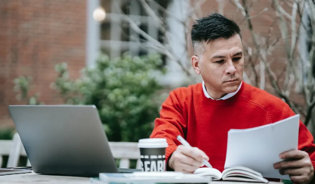 a man is studying for cmrp certification